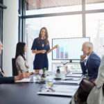 Business woman executive team leader gives a strategic presentation in a conference room