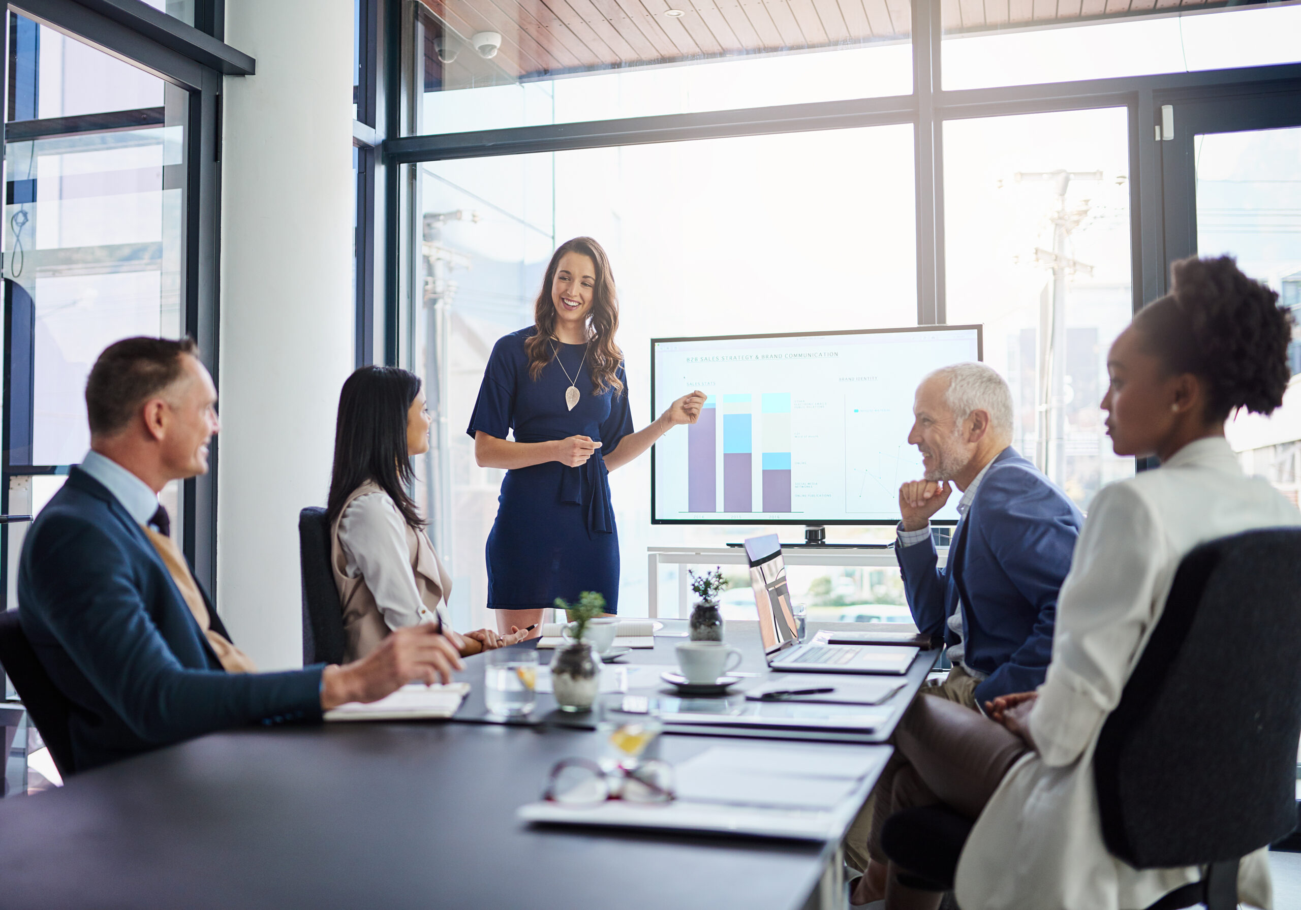 Business woman executive team leader gives a strategic presentation in a conference room